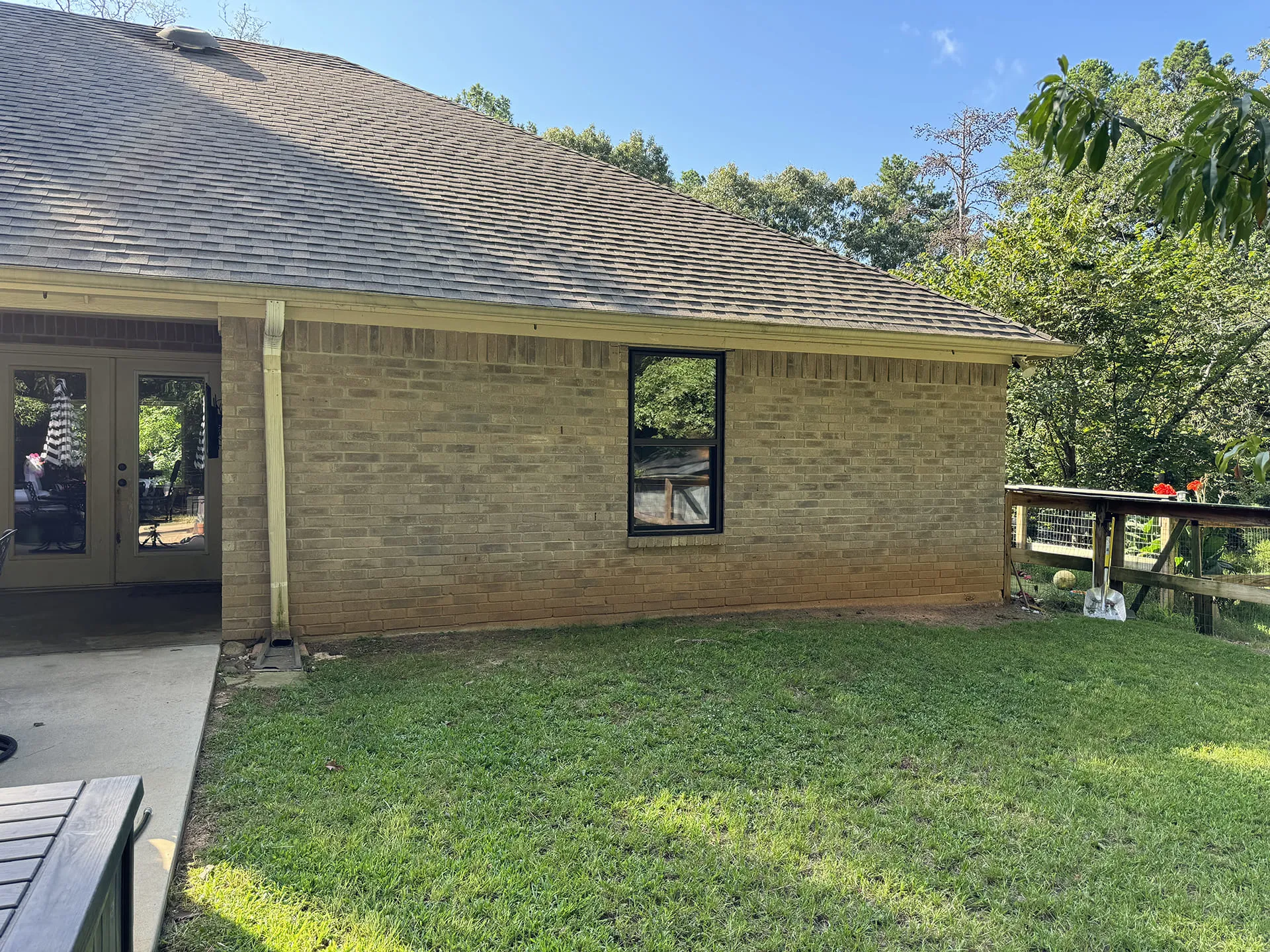 Brick house window installation from back