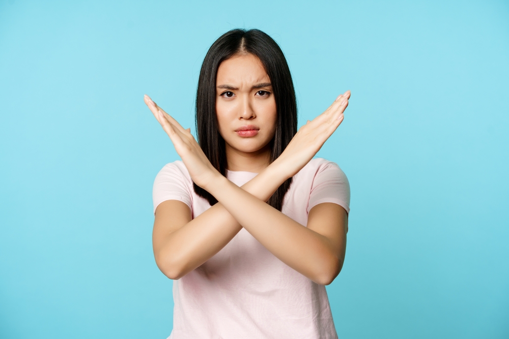 Young Woman Objecting to Buying New Windows